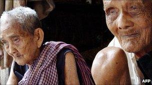 Sek Yim, right, 120, and his wife Ouk, 108