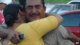 Victim's relatives grieve outside the factory. 7 Sept 2010