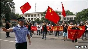 Protesters gather outside the Japanese embassy in Beijing