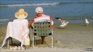 An elderly couple on the beach