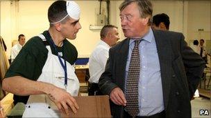 A prisoner talking to Justice Secretary Ken Clarke