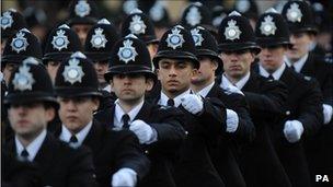 Newly qualified police officers at the Peel Centre in Hendon, north London take part in a passing out parade.