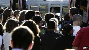 Commuters in London boarding a train