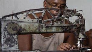 Manuel Cardenas repairs shoes in La Habanera state-run workshop in Havana