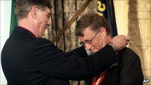 Microsoft co-founder Bill Gates, right, is presented with the Boy Scouts Silver Buffalo award by Wayne Perry, national president of the Boy Scouts