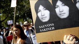 Demonstrators holds a picture of Sakineh Mohammadi Ashtiani a 43-year-old mother of two, who was sentenced to death in Iran, in Paris