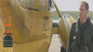 Prince William next to a rescue helicopter