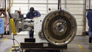 Man working on a pump for the hydraulic fracturing process used to release trapped oil and gas. Pic from Weir Group