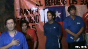 A frame grab shows trapped miners singing the national anthem during celebrations of the bicentenary of Chile's independence