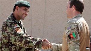 Major Richard Forsyth saying goodbye to the man he has advised for the past six months in Sangin,Captain Nadri, of the Afghan National Army