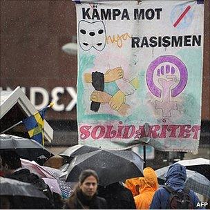 Banner in Sweden reads "fight racism"