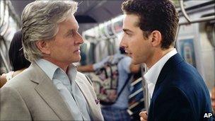 Michael Douglas portrays Gordon Gekko, left, and Shia LaBeouf portrays Jake Moore in a scene from, "Wall Street: Money Never Sleeps."