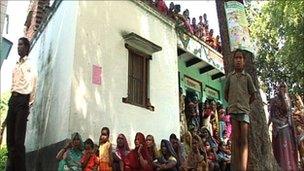 villagers watch Ikea's chief executive Mikael Ohlsson