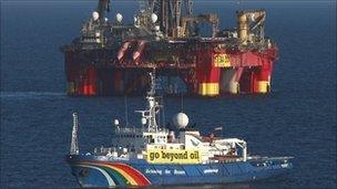 Greenpeace boat in front of oil rig off Greenland