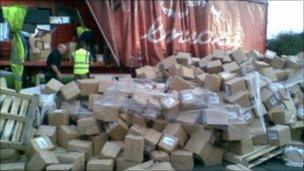 Overturned lorry and spilled books