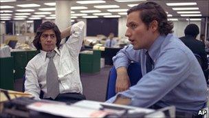 Reporters Bob Woodward, right, and Carl Bernstein, sit in the newsroom of the Washington Post, May 7, 1973