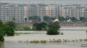 Flood water from the Yamuna River rises by the Commonwealth Games village