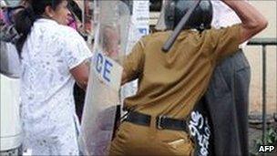 A Sri Lankan policeman baton charging the protesters (file photo)