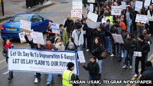 People marching through the streets of north London