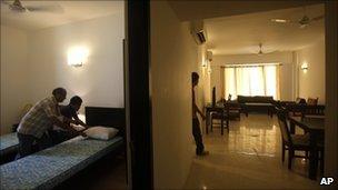 Cleaning one of the athletes' village rooms