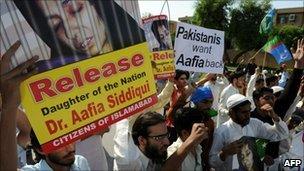 Pakistani protesters march during an anti-US protest rally in Karachi on September 24, 2010, against the detention of Pakistani woman Aafia Siddiqui in the US