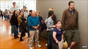 Aspiring film extras queue during an audition to be part of The Hobbit movies