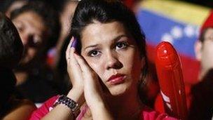 Supporters of Venezuela's President Hugo Chavez listen to the electoral results in Caracas early on Monday morning