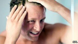 Man checking for balding