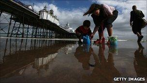 A family on a beach in Eastbourne