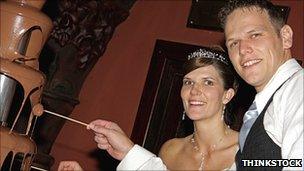 Newlyweds with chocolate fountain