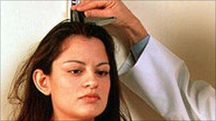 Woman being measured
