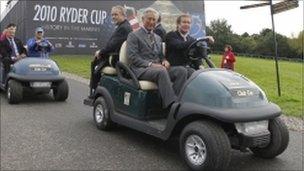 Prince Charles in golf buggy at Celtic Manor