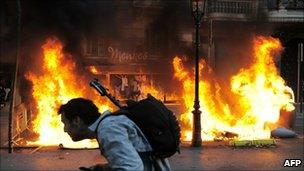 Garbage containers burns in central Barcelona during the general strike held in Spain on September 29, 2010