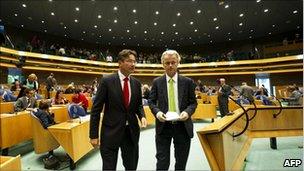 Geert Wilders (right) with Maxime Verhagen in the Dutch parliament, 7 September 2010