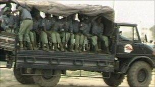 Soldiers in a military vehicle