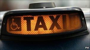 Close up of sign on London taxi