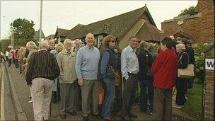 People queuing at polling station