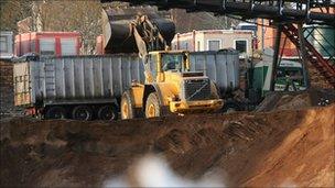 Gritting lorry is filled with salt