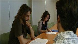 Paulo (with his back to the camera) attends a dissuasion board.