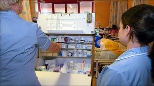 Nurses dispense drugs on a hospital ward, Shropshire, England, 2006