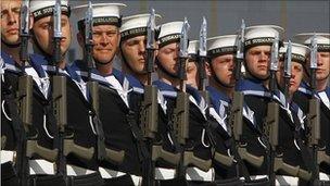 Crew members line up before the commissioning ceremony of the Royal Navy submarine HMS Astute at the Clyde Naval Base near Glasgow