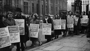 1952: Men and women take part in a protest march demanding equal pay for female employees of the British civil service.