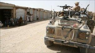 UK troops patrol in Helmand Province, Afghanistan, June 2008, in a Land Rover Defender with a Weapons Mounted Installation Kit.