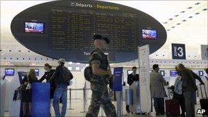 A soldier patrols Paris Charles de Gaulle airport - 4 October 2010