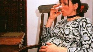 Pregnant woman drinking