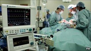 NHS surgeons carrying out an operation