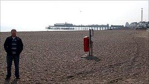 The BBC's James Clarke by Hastings Pier in April 2009