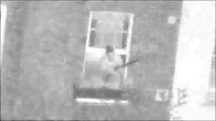 Mark Saunders with a gun at his home