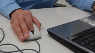 Man with mouse and laptop