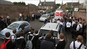 Crowd outside Gamu's house